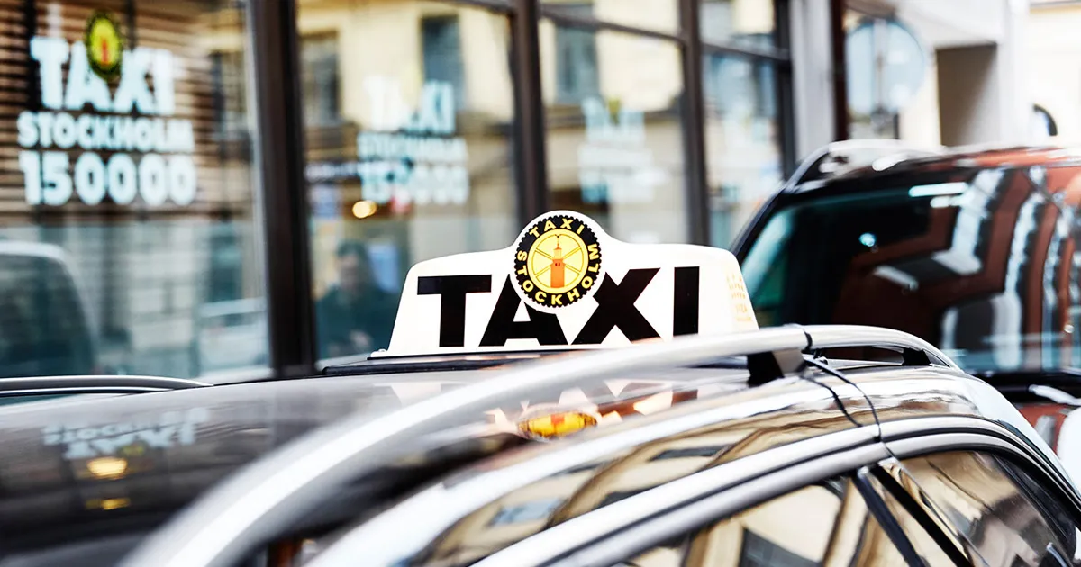 A Taxi Stockholm car with the 15 00 00 number on its side